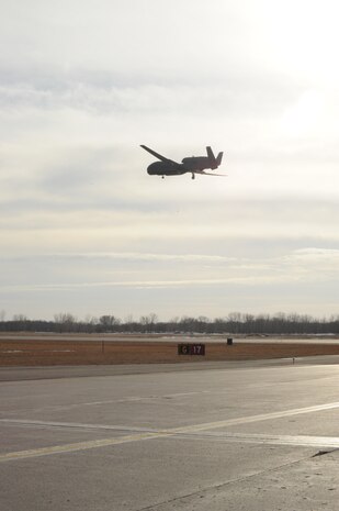 An RQ-4 Global Hawk comes in to land on Grand Forks Air Force Base, N.D., March 29, 2014. This aircraft from the 348th Reconnaissance Squadron had just set a new record for longest flight by a military aircraft without air refueling, remaining aloft for 34.3 hours. (U.S. Air Force photo/Staff Sgt. David Dobrydney)