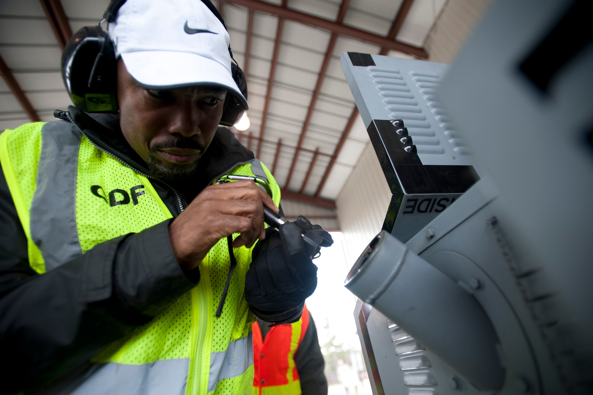 Virgil Parks, 437th Aerial Port Squadron hazardous material inspector, inspects the gas tank of a piece of cargo during an exercise March 26, 2014, at Joint Base Charleston – Air Base, S.C. The cargo prepared by 437th APS was used in a large formation exercise which provided more than 500 operational and maintenance training objectives and demonstrated the U.S. Air Force's strategic capability. (U.S. Air Force photo/ Staff Sgt. William A. O’Brien)