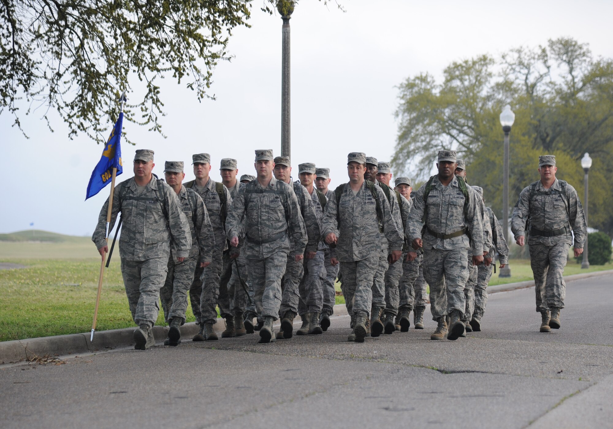 Member of the 602nd Training Group (Provisional) march in formation toward the Pass Road Gate during an 84-mile ruck march April 2, 2014, at Keesler Air Force Base, Miss.  The 2-day march, which began on Keesler and will end at Camp Shelby Army Post, Miss., took place to commemorate the 602nd TRG (P) mission in support of Joint Expeditionary Taskings and to their students who made the ultimate sacrifice. (U.S. Air Force photo by Kemberly Groue)