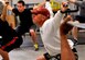 Airmen perform bodyweight overhead squats during a group workout class as part of the Life of a Warrior campaign March 28, 2014, at Creech Air Force Base, Nev. The Life of a Warrior campaign is a way for Airmen to build camaraderie while improving fitness and strength.  (U.S. Air Force photo by Airman 1st Class C.C./Released)                              
