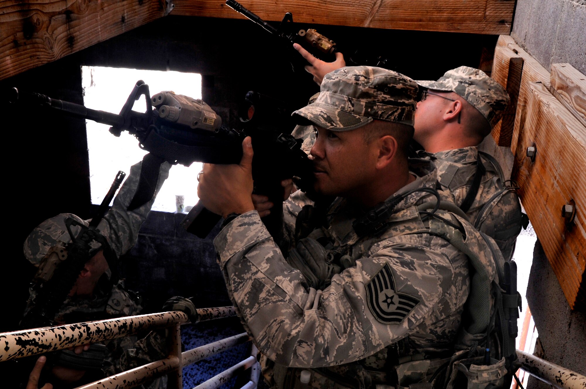 Tech. Sgt. Markus Mindoro takes point in a fire team formation during an urban operations stair clearing exercise March 5, 2014, Silver Flag Alpha, 99th Ground Combat Training Squadron Range, Nev. The 99th GCTS is one of eight Security Forces Regional Training Centers and prepares security forces Airmen for combat. (U.S. Air Force photo by Airman 1st Class C.C./Released)