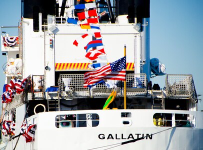 The American flag flies at the stern of United States Coast Guard Cutter Gallatin (WHEC-721), during its decommissioning ceremony March 31, 2014, in Charleston, S.C.  The Gallatin is being replaced by a new National Security Cutter, USCGC Hamilton (WMSL-753).  (U.S. Air Force photo/ Staff Sgt. Aaron Thomasson)