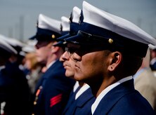 Current and former United States Coast Guard Cutter Gallatin (WHEC-721) crewmembers, stand at attention as the cutter is formally decommissioned March 31, 2014, in Charlston, S.C.  The Gallatin is being transferred to the Nigerian Navy following its decommissioning.  (U.S. Air Force photo/ Staff Sgt. Aaron Thomasson)