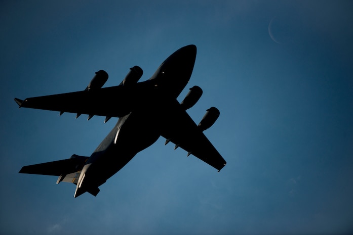 A C-17 Globemaster III flies over Joint Base Charleston, S.C., during a large formation exercise March 27, 2014. The large formation exercise provided more than 500 operational and maintenance training objectives and demonstrated the U.S. Air Force's strategic capability. (U.S. Air Force photo/ Senior Airman Dennis Sloan)