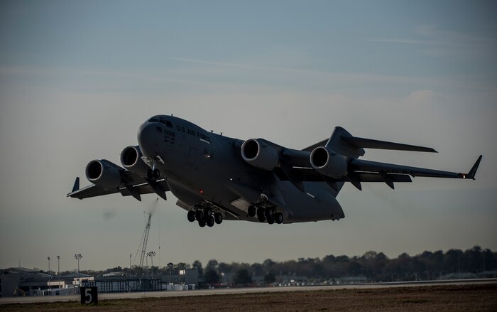 A C-17 Globemaster III takes off during a large formation exercise March 27, 2014, at Joint Base Charleston, S.C.  The large formation exercise provided more than 500 operational and maintenance training objectives and demonstrated the U.S. Air Force's strategic capability. (U.S. Air Force photo/ Senior Airman Dennis Sloan)