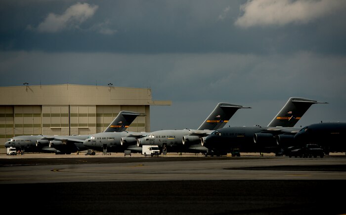The sun shines down on the flightline at Joint Base Charleston, S.C., as 437th Aircraft Maintenance Squadron crew chiefs prepare nine C-17 Globemaster III aircraft for a large formation exercise March 25, 2014. The large formation exercise provided more than 500 operational and maintenance training objectives and demonstrated the U.S. Air Force's strategic capability. (U.S. Air Force photo/ Senior Airman Dennis Sloan)