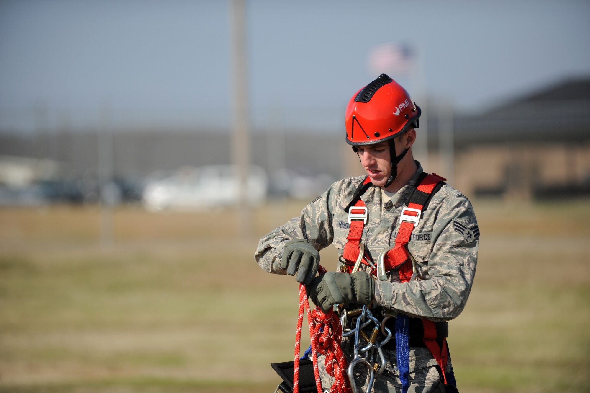 Senior Airman Corey Rhoads, a 19th Communications Squadron airfield systems technician, inspects his safety rope prior to climbing a radio tower March 25, 2014, at Little Rock Air Force Base, Ark. Inspecting all ropes and harnesses prior to climbing is a good safety practice and vital to mission success. (U.S. Air Force photo by Airman 1st Class Scott Poe) 