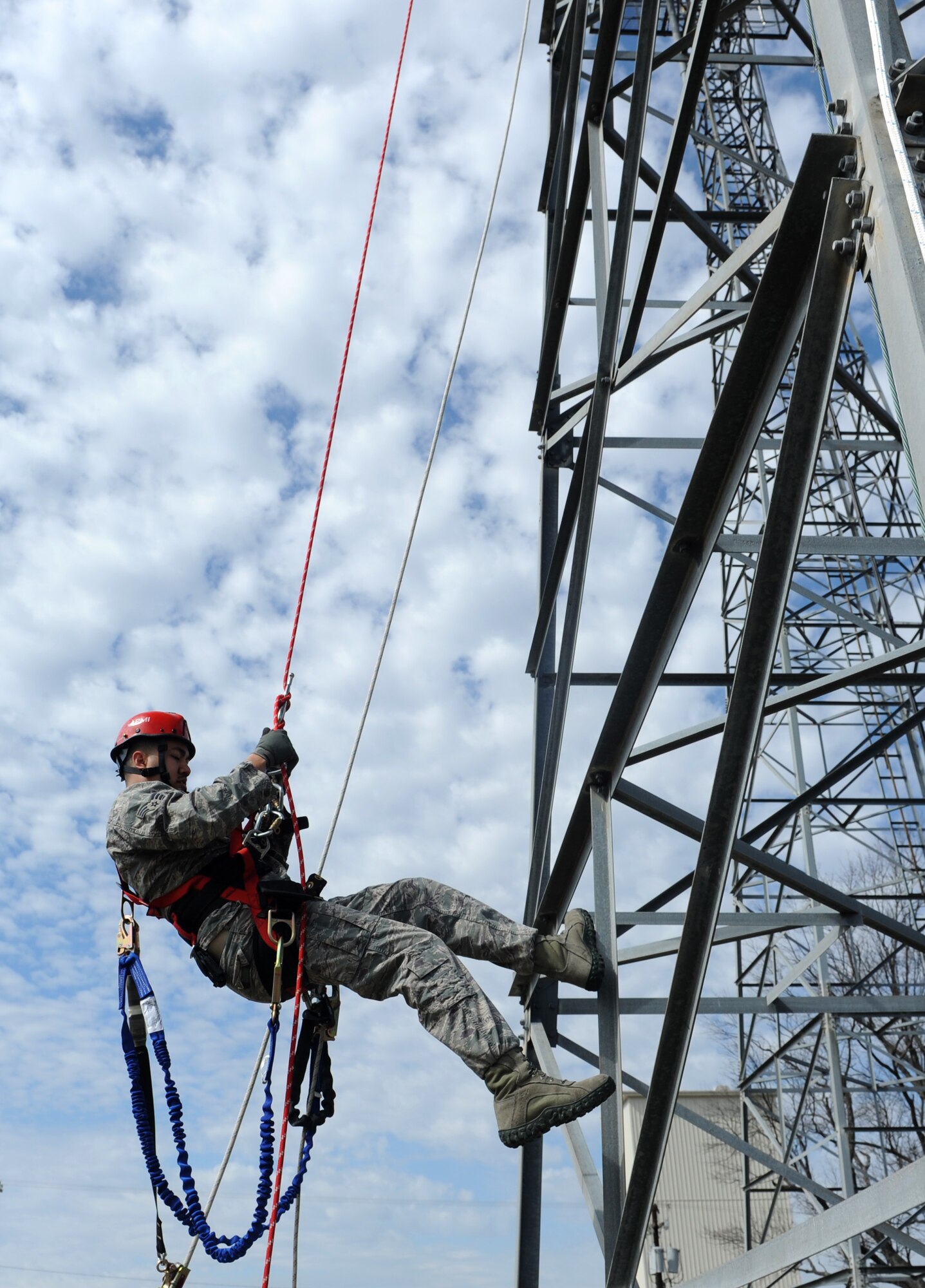 Senior Airman Edward Sharp, a 19th Communications Squadron airfield systems technician, hones his climbing and rapelling skills during annual climbing training March 14, 2014, at Little Rock Air Force Base, Ark. Airmen from the 19th CS must be comfortable working at heights of up to 130 feet. (U.S. Air Force photo by Airman 1st Class Scott Poe) 