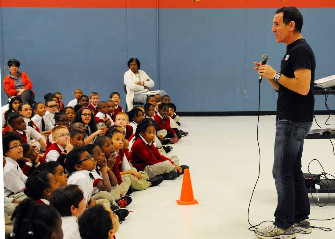 Trevor Romain, award-winning author, engages with students during a visit to the Imagine Andrews Public Charter School on Joint Base Andrews, Md., March 26 as part of the 2014 “With You All The Way” Tour. The Trevor Romain Group and the United Services Organizations (USO) promote resiliency for children. (U.S. Air Force photo by Aimee Fujikawa)