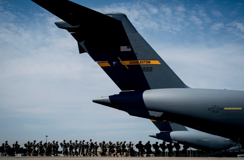 Soldiers from the 82nd Airborne Division, Ft. Bragg, N.C., file into a C-17 Globemaster III March 27, 2014, on the flightline at Ft. Bragg, N.C. The paratroopers were part of a large formation exercise which provided more than 500 operational and maintenance training objectives and demonstrated the U.S. Air Force’s strategic capability. (U.S. Air Force photo/ Airman 1st Class Clayton Cupit)