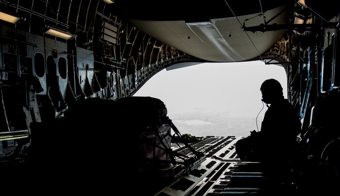 Staff Sgt. Manuel Chacon, 15th Airlift Squadron loadmaster, waits for a heavy pallet to be dropped from a Joint Base Charleston, S.C., C-17 Globemaster III, March 27, 2014. The cargo drops were part of a large formation exercise which provided more than 500 operational and maintenance training objectives and demonstrated the U.S. Air Force’s strategic capability. (U.S. Air Force photo/ Airman 1st Class Clayton Cupit)