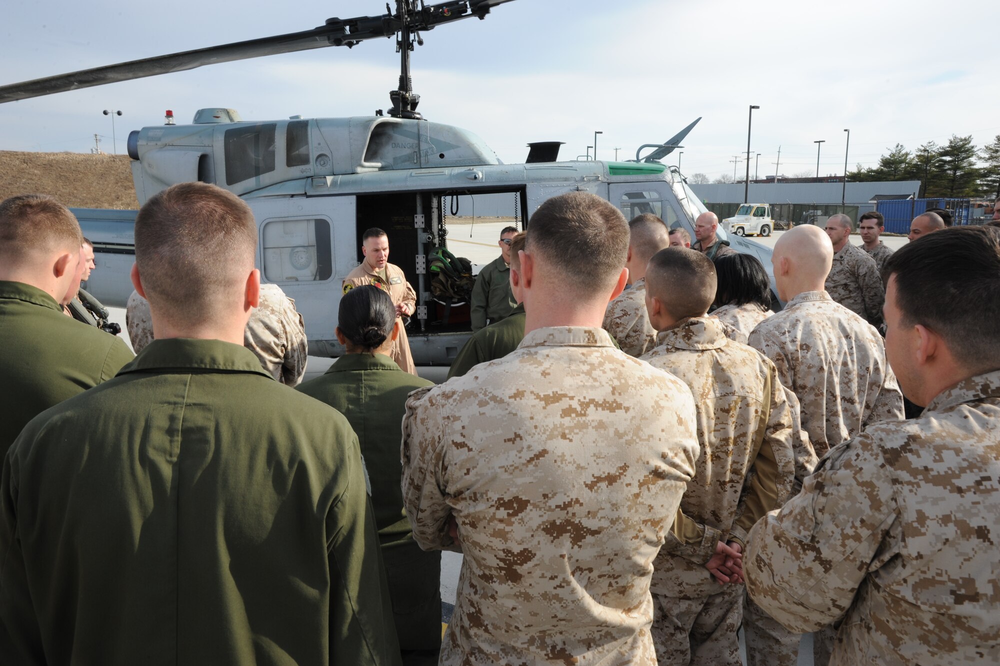 Marine Lt. Col. Theodore Batzel, Marine Light attack Helicopter Squadron (HMLA) 773 Detachment B commander, speaks to HMLA-773 Marines following the UH-1N Huey’s final flight for the squadron March 27, 2014, at Joint Base McGuire-Dix-Lakehurst, N.J. Batzel explained to the Marines that they will have a lot of hard work ahead of them adjusting to the UH-1Y Venom. (U.S. Air Force photo by Airman 1st Class Sean M. Crowe/Released)