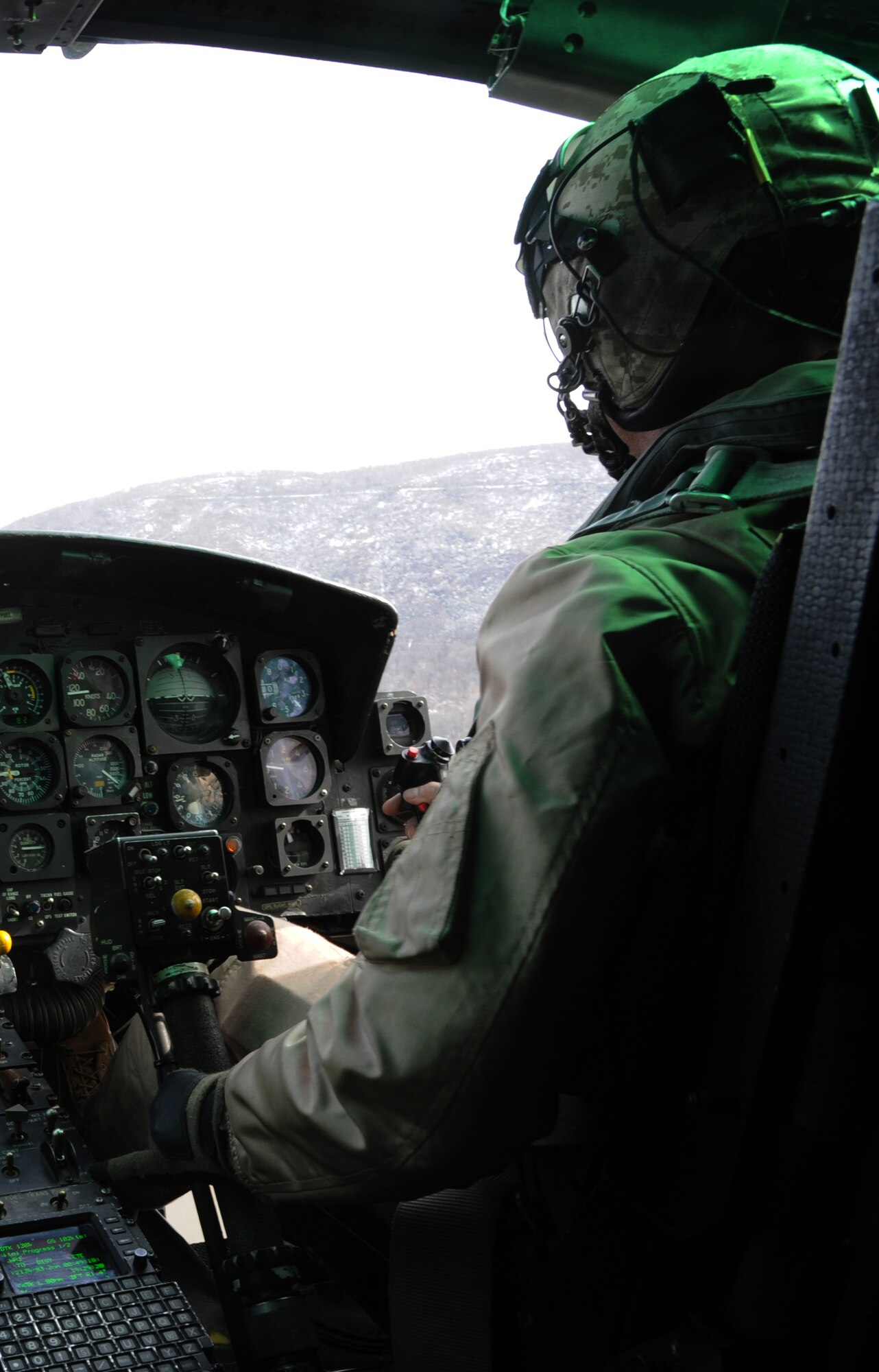 Marine Capt. Daniel Turaj, Marine Light Attack Helicopter Squadron (HMLA) 773 pilot, flies a UH-1N Huey for the aircraft’s final flight in the squadron March 27, 2014, out of Joint Base McGuire-Dix-Lakehurst, N.J. The squadron will receive the improved UH-1Y Venom, which will allow them to better support Marines on the ground from the air. (U.S. Air Force photo by Airman 1st Class Sean M. Crowe/Released)
