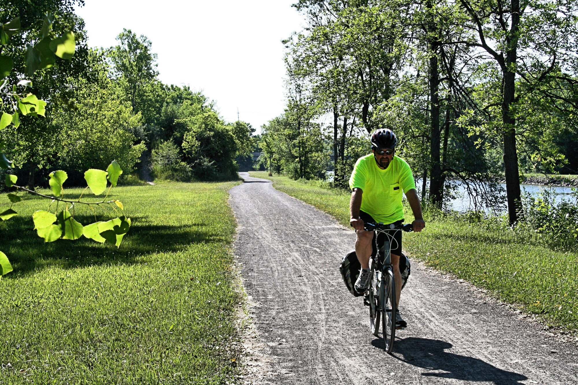 Wesley Willand riding the towpath used by draft animals pulling barges on the Erie Canal near Brockport NY, during a bicycle trip across North America.  (Courtesy photo) 