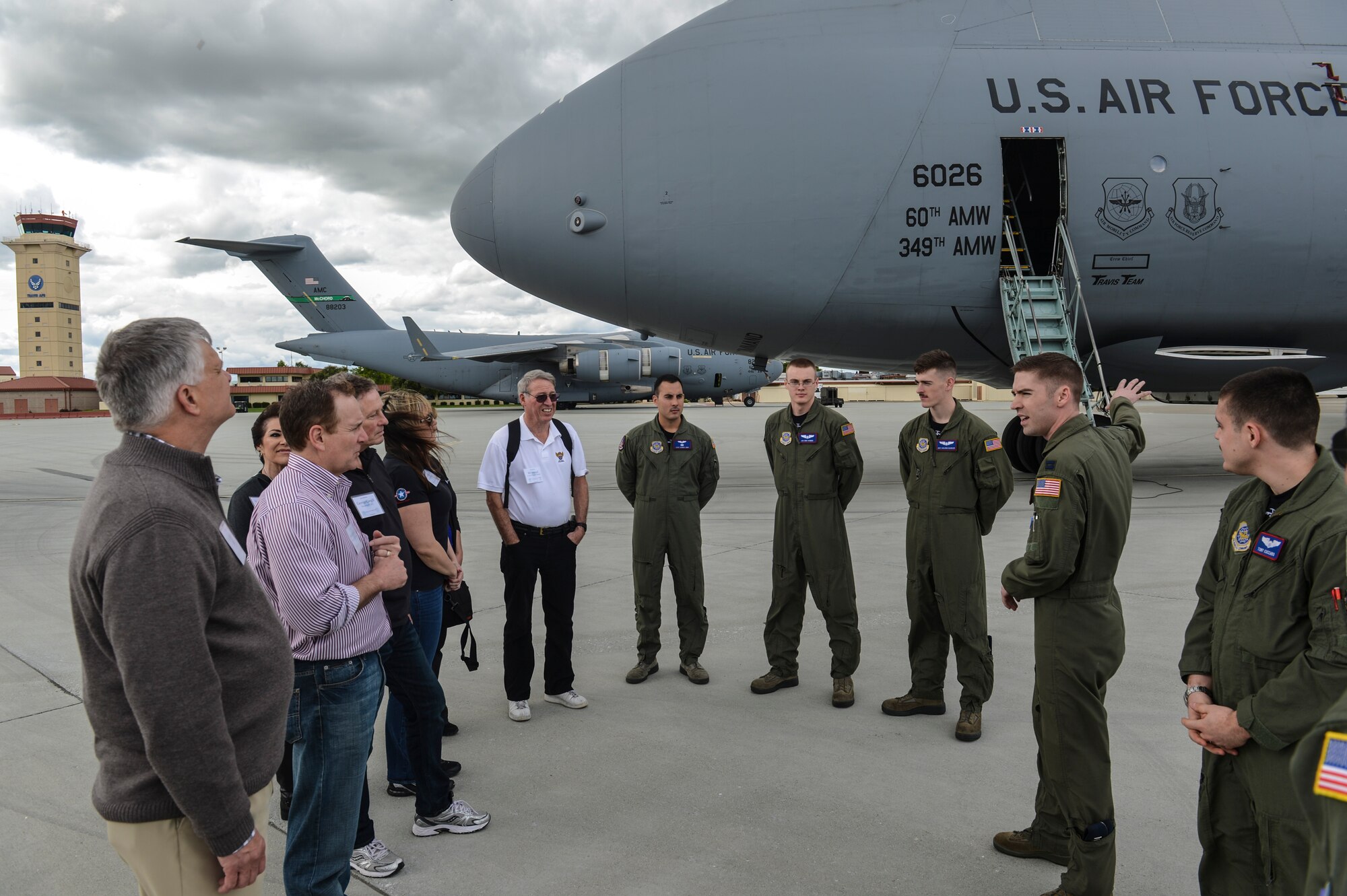 Crew members of a C-5 Galaxy brief civic leaders from Joint Base Lewis-McChord, Wash., about the features of the aircraft March 28, 2014, during the Fly-Away Civic Leader Tour at Travis Air Force Base, Calif. Along with the C-5, Travis AFB maintains a fleet of KC-10 Extender and C-17 Globemaster III aircraft. (U.S. Air Force photo by Staff Sgt. Russ Jackson)