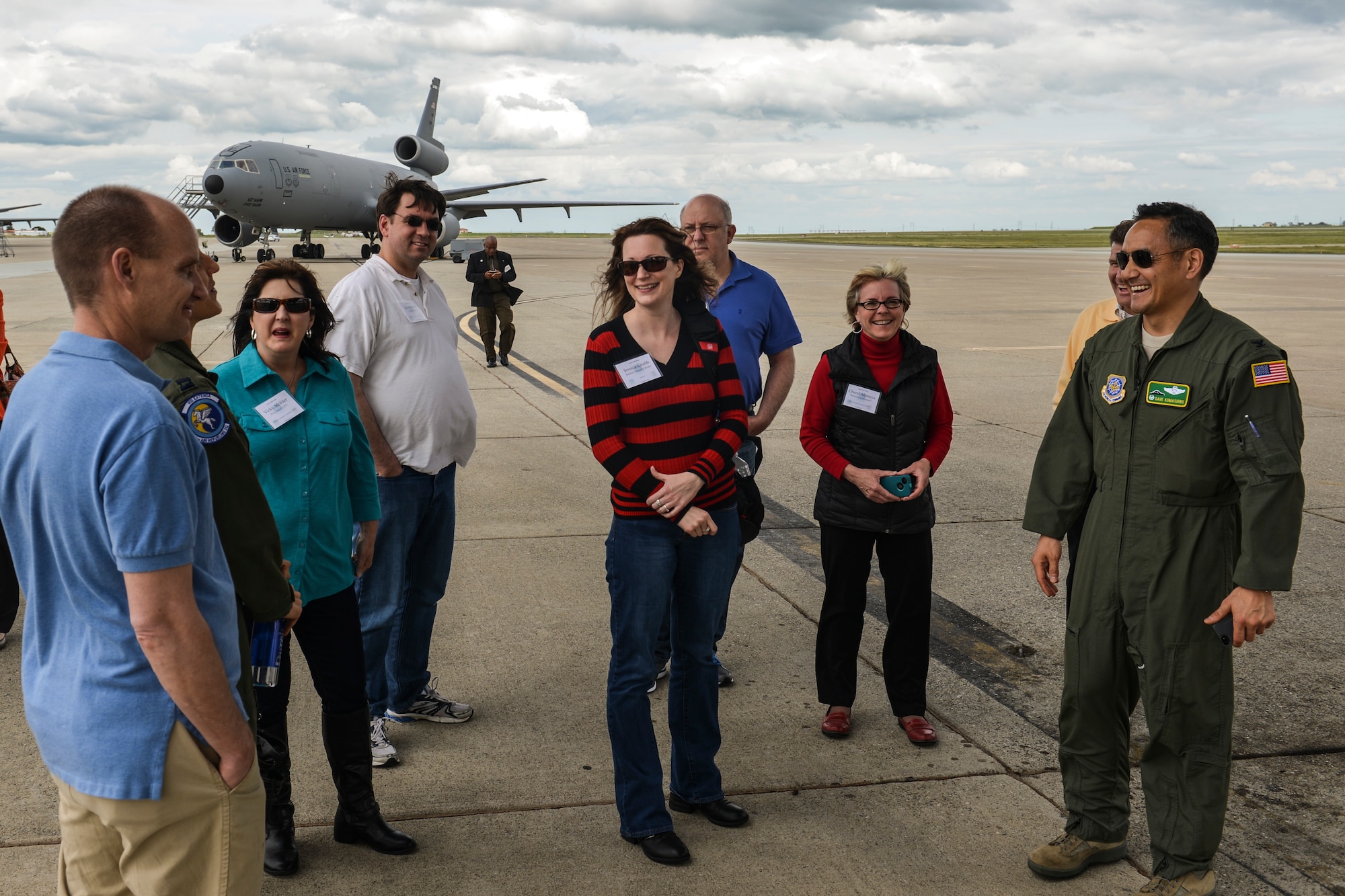 Col. David Kumashiro, 62nd Airlift Wing commander, chats with civic leaders from Joint Base Lewis-McChord, Wash., about the process of air refueling from a KC-10 Extender at during the Fly-Away Civic Leader Tour at Travis Air Force Base, Calif., March 28, 2014. The civic leaders from JBLM were able to speak with KC-10 crew members from Travis AFB about the aspects of their jobs. (U.S. Air Force photo by Staff Sgt. Russ Jackson)