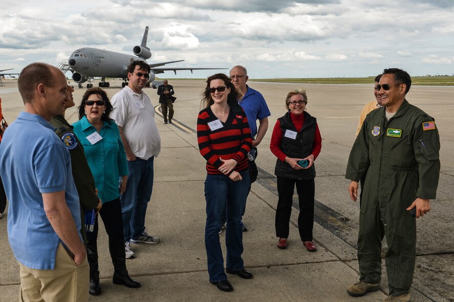Col. David Kumashiro, 62nd Airlift Wing commander, chats with civic leaders from Joint Base Lewis-McChord, Wash., about the process of air refueling from a KC-10 Extender at during the Fly-Away Civic Leader Tour at Travis Air Force Base, Calif., March 28, 2014. The civic leaders from JBLM were able to speak with KC-10 crew members from Travis AFB about the aspects of their jobs. (U.S. Air Force photo by Staff Sgt. Russ Jackson)