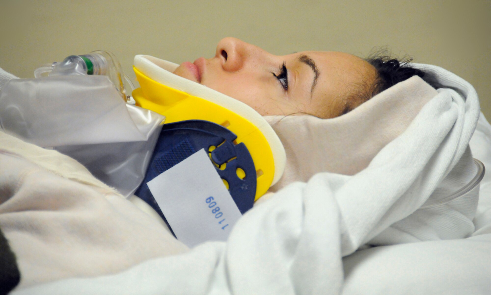 A simulated natural disaster casualty waits at the base hospital for transport during an evacuation drill as part of Mission Assurance Exercise 14-3 at Joint Base Elmendorf-Richardson, Alaska, March 31, 2014. MAE 14-3 is a JBER exercise testing the base’s ability to survive, operate and coordinate during a major natural disaster.   (U.S. Air Force photo/Justin Connaher)