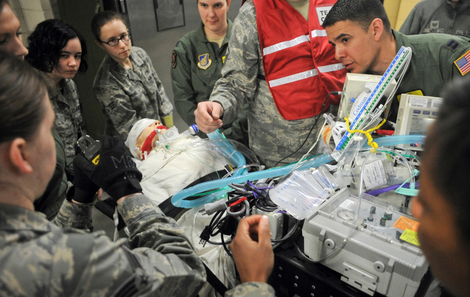 Airmen of the 673d Medical Group prepare a simulated natural disaster casualty for transport during an evacuation drill as part of Mission Assurance Exercise 14-3 at Joint Base Elmendorf-Richardson, Alaska, March 31, 2014. MAE 14-3 is a JBER exercise testing the base’s ability to survive, operate and coordinate during a major natural disaster.   (U.S. Air Force photo/Justin Connaher)