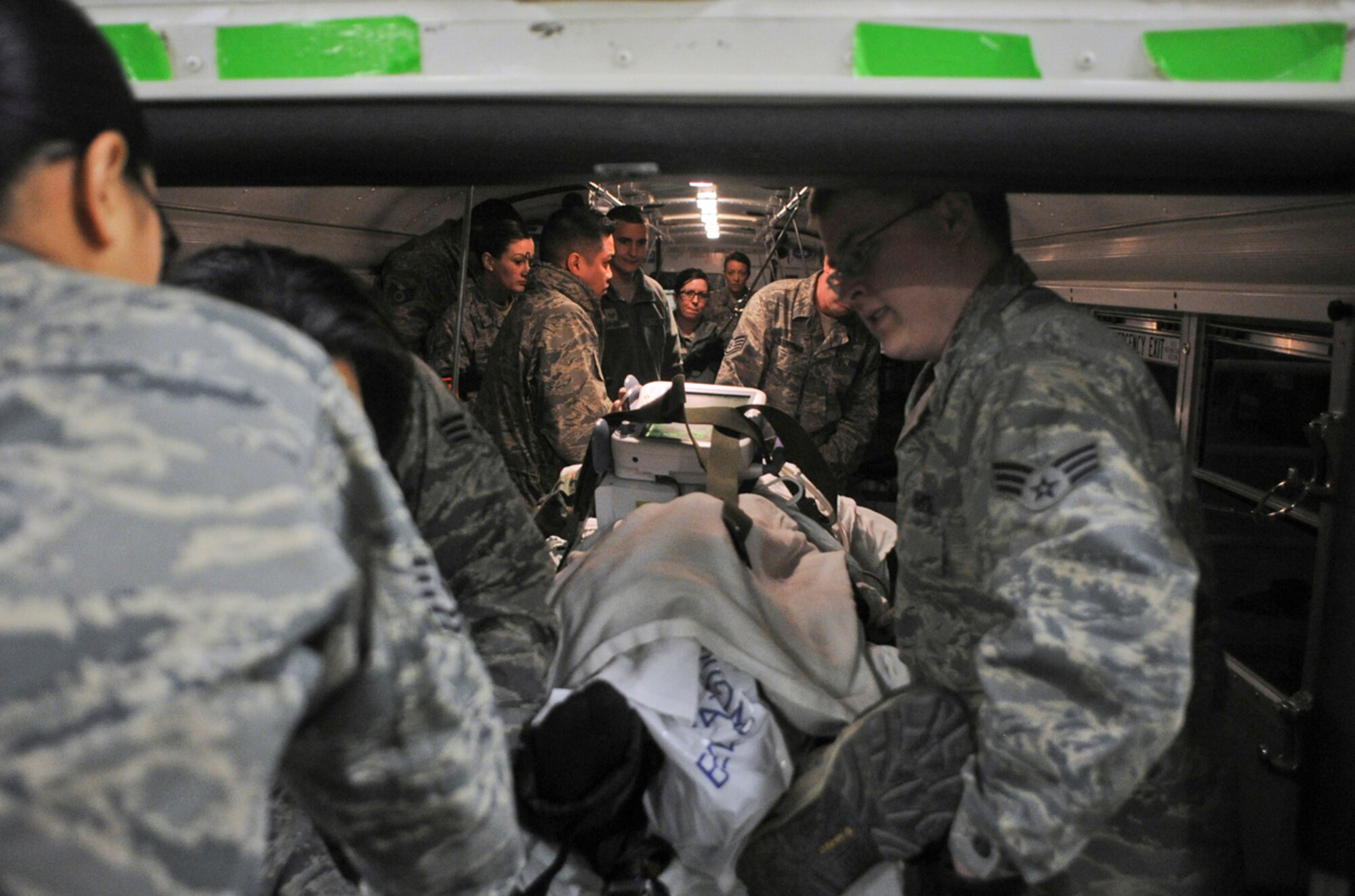Airmen of the 673d Medical Group prepare simulated natural disaster casualties for transport during an evacuation drill as part of Mission Assurance Exercise 14-3 at Joint Base Elmendorf-Richardson, Alaska, March 31, 2014. MAE 14-3 is a JBER exercise testing the base’s ability to survive, operate and coordinate during a major natural disaster.   (U.S. Air Force photo/Justin Connaher)