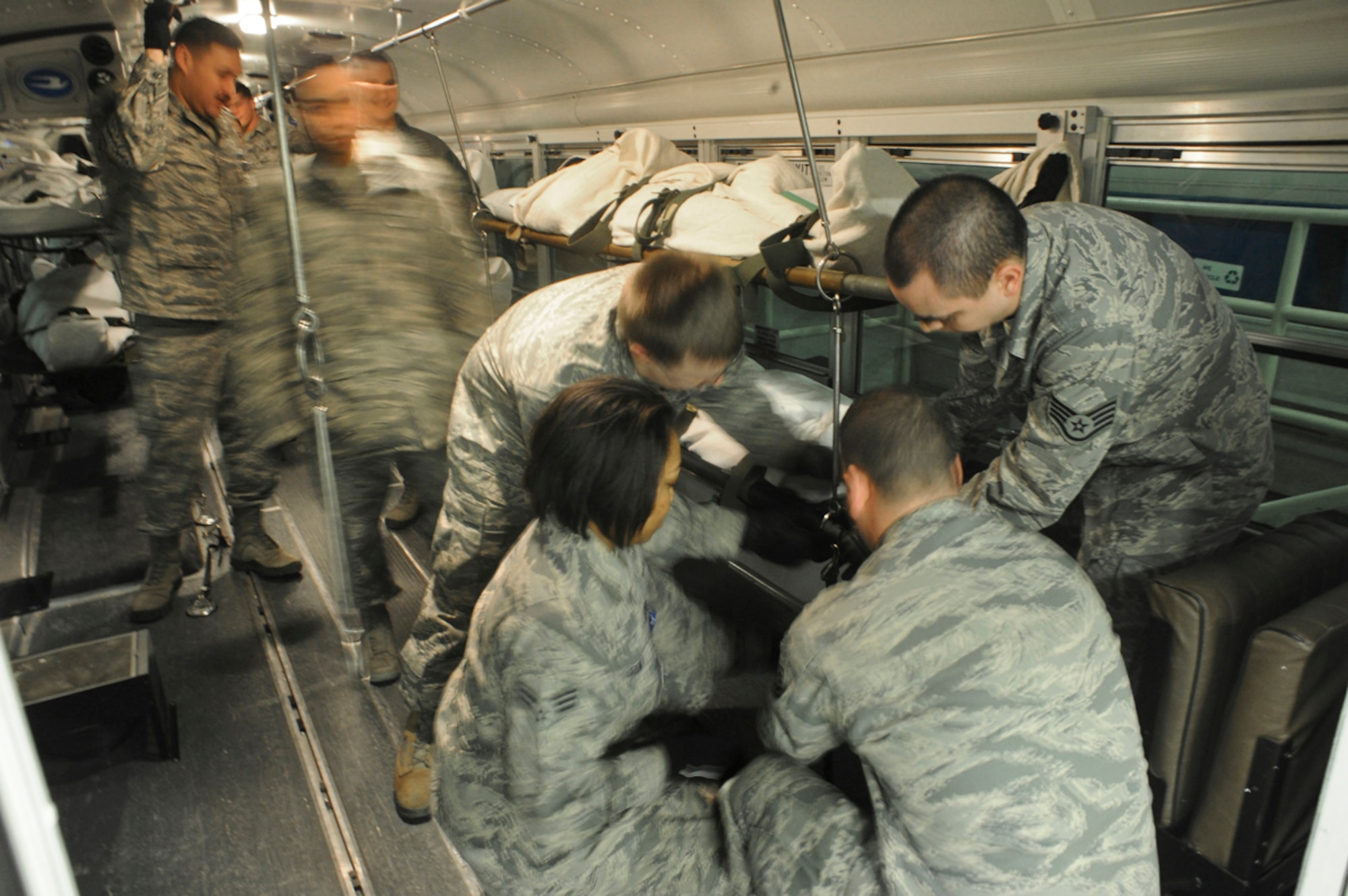 Airmen of the 673d Medical Group prepare simulated natural disaster casualties for transport during an evacuation drill as part of Mission Assurance Exercise 14-3 at Joint Base Elmendorf-Richardson, Alaska, March 31, 2014. MAE 14-3 is a JBER exercise testing the base’s ability to survive, operate and coordinate during a major natural disaster.   (U.S. Air Force photo/Justin Connaher)