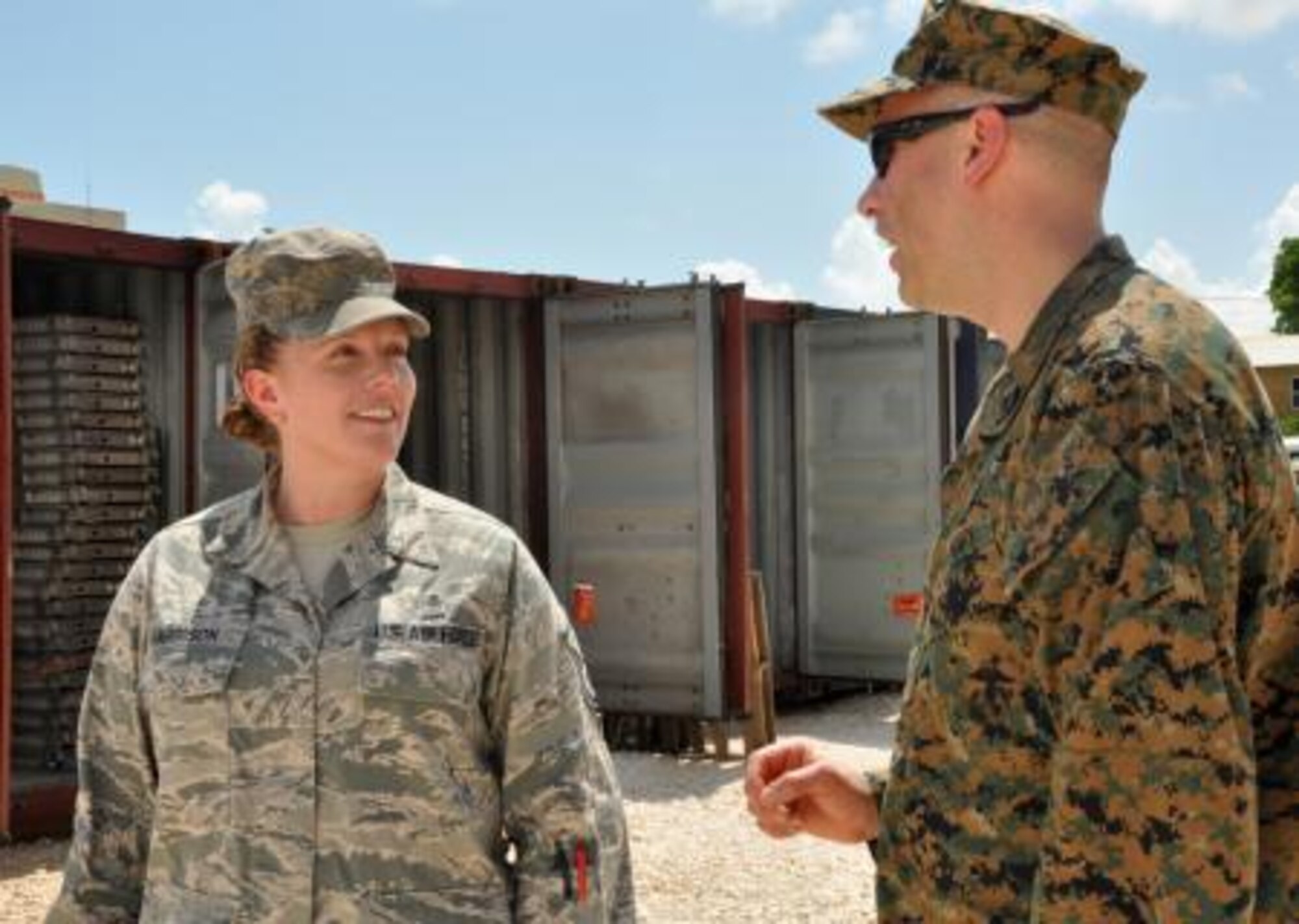 U.S. Air Force Master Sgt. Tara Harrison, independent duty medical technician and New Horizons lead medic for U.S. service members, discusses the availability of medical supplies with U.S Navy Petty Officer 1st Class Tim Greer, a 472nd Marine Wing Support Squadron hospital corpsman, March 31, 2014, at the Edward P. Yorke school construction site in Belize City, Belize. Greer, a six-year corpsman from Shelton, Conn., tasked with providing medical care to U.S. Marines, and Harrison, a 19-year IDMT, discussed supply inventories and medical considerations as they provide care for U.S. service members during New Horizons Belize 2014. (U.S. Air Force photo by Tech. Sgt. Kali L. Gradishar/Released)






