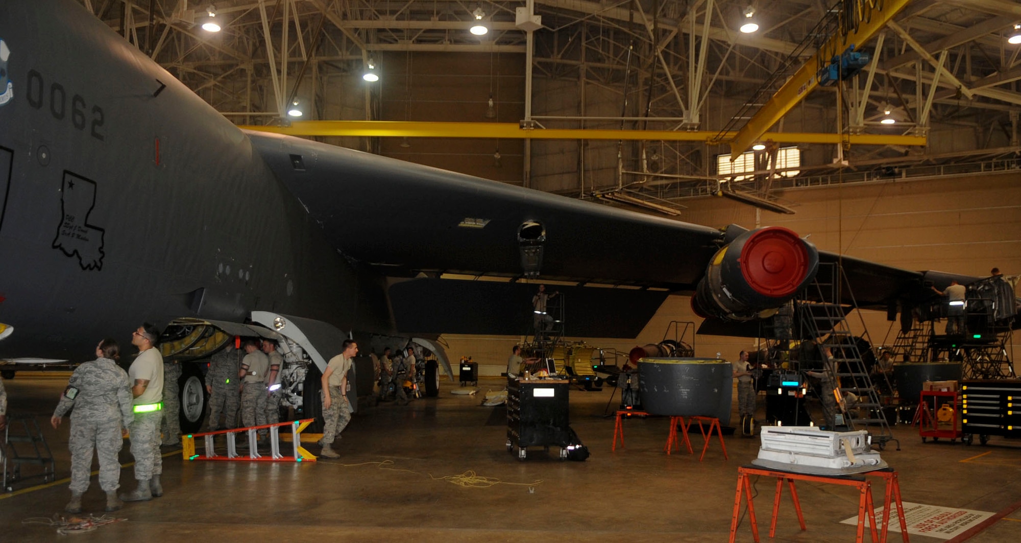 Airmen from the 2nd Maintenance Squadron work on a B-52H Stratofortress on Barksdale Air Force Base, La., March 31, 2014. The various jobs these Airmen fulfill to inspect and repair the aircraft while in the phase hangar include hydraulics, propulsion, crew chiefs, electricians, sheet metal and many more. (U.S. Air Force photo/Senior Airman Kristin High)
