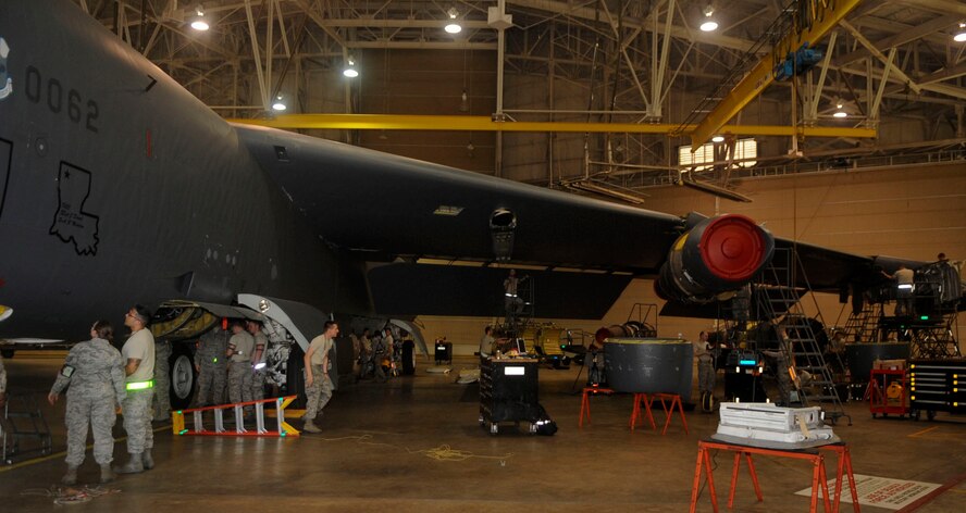 Airmen from the 2nd Maintenance Squadron work on a B-52H Stratofortress on Barksdale Air Force Base, La., March 31, 2014. The various jobs these Airmen fulfill to inspect and repair the aircraft while in the phase hangar include hydraulics, propulsion, crew chiefs, electricians, sheet metal and many more. (U.S. Air Force photo/Senior Airman Kristin High)