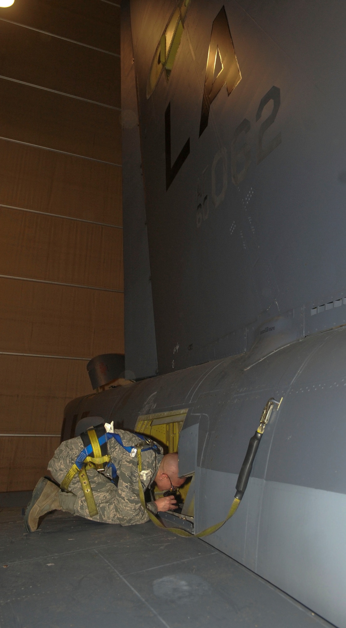 Airman 1st Class Christian Sauceda, 2nd Maintenance Squadron crew chief, conducts an inspection inside the right horizontal stabilizer on a B-52H Stratofortress on Barksdale Air Force Base, La., March 31, 2014. During the inspection, Sauceda checked for loose panels and any structure damage that may have occurred during flight. (U.S. Air Force photo/Senior Airman Kristin High)