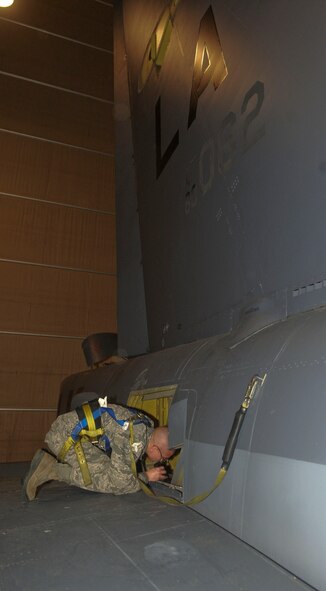 Airman 1st Class Christian Sauceda, 2nd Maintenance Squadron crew chief, conducts an inspection inside the right horizontal stabilizer on a B-52H Stratofortress on Barksdale Air Force Base, La., March 31, 2014. During the inspection, Sauceda checked for loose panels and any structure damage that may have occurred during flight. (U.S. Air Force photo/Senior Airman Kristin High)