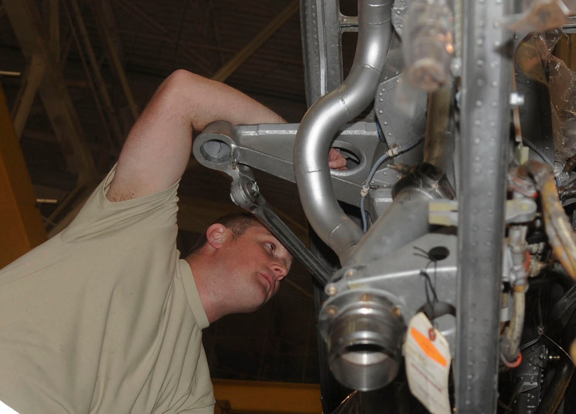 Tech Sgt. Keith Wolsey, 2nd Maintenance Squadron aircraft recovery technician, rigs throttle cables on a B-52H Stratofortress on Barksdale Air Force Base, La., March 31, 2014. The throttle cables help control fuel output during flight and are replaced as needed from wear and tear during the flight. (U.S. Air Force photo/Senior Airman Kristin High)