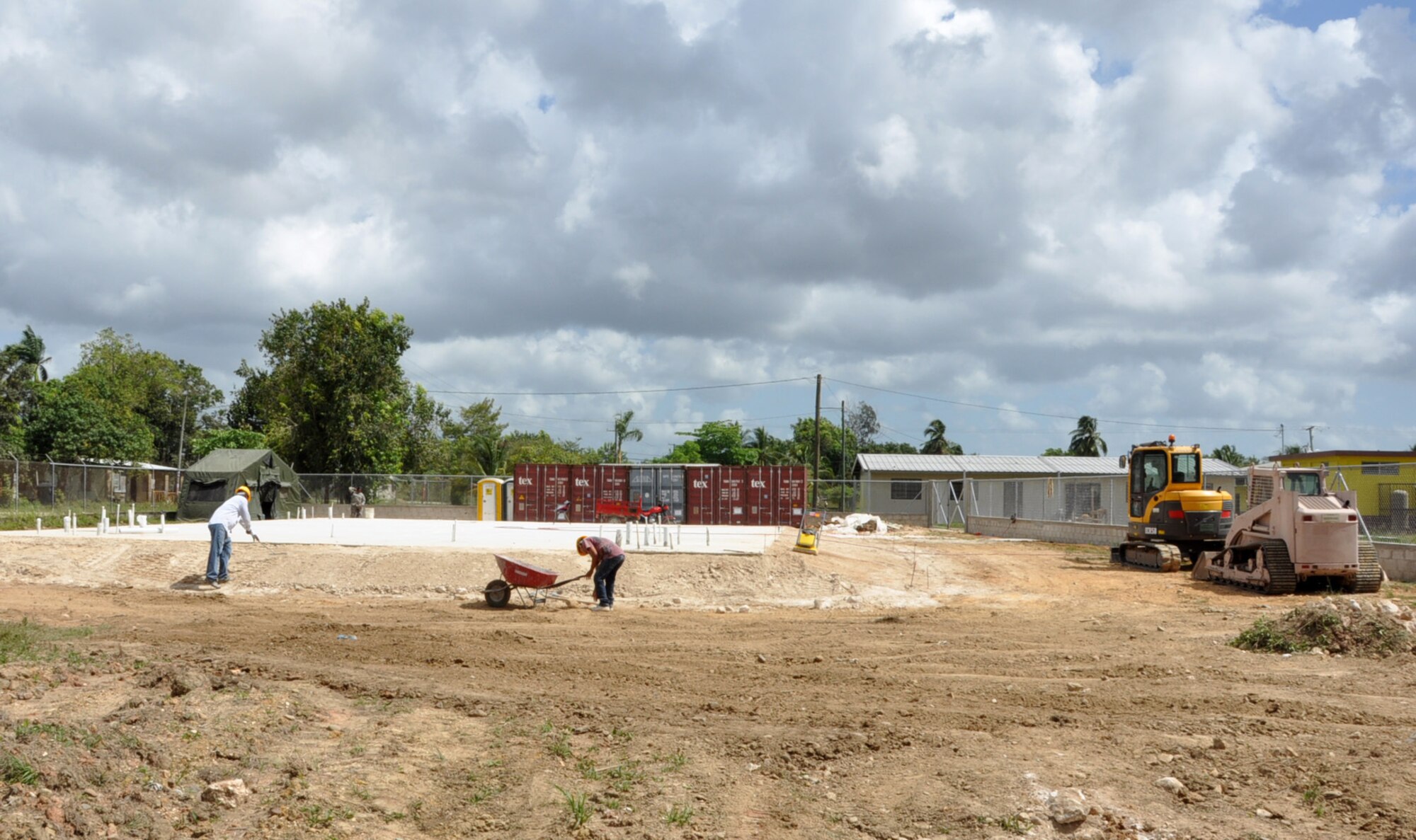 Belizean contractors make final preparations at the Hattieville school construction site March 26, 2014, in Belize City, Belize. Sadie Vernon is one of five construction sites throughout Belize where Belizean Defence Force engineers and U.S. service members will team up to build partnerships and learn from one another. The construction is part of New Horizons Belize 2014, an exercise to enhance BDF and U.S. construction and medical processes. (U.S. Air Force photo by Tech. Sgt. Kali L. Gradishar/Released)






