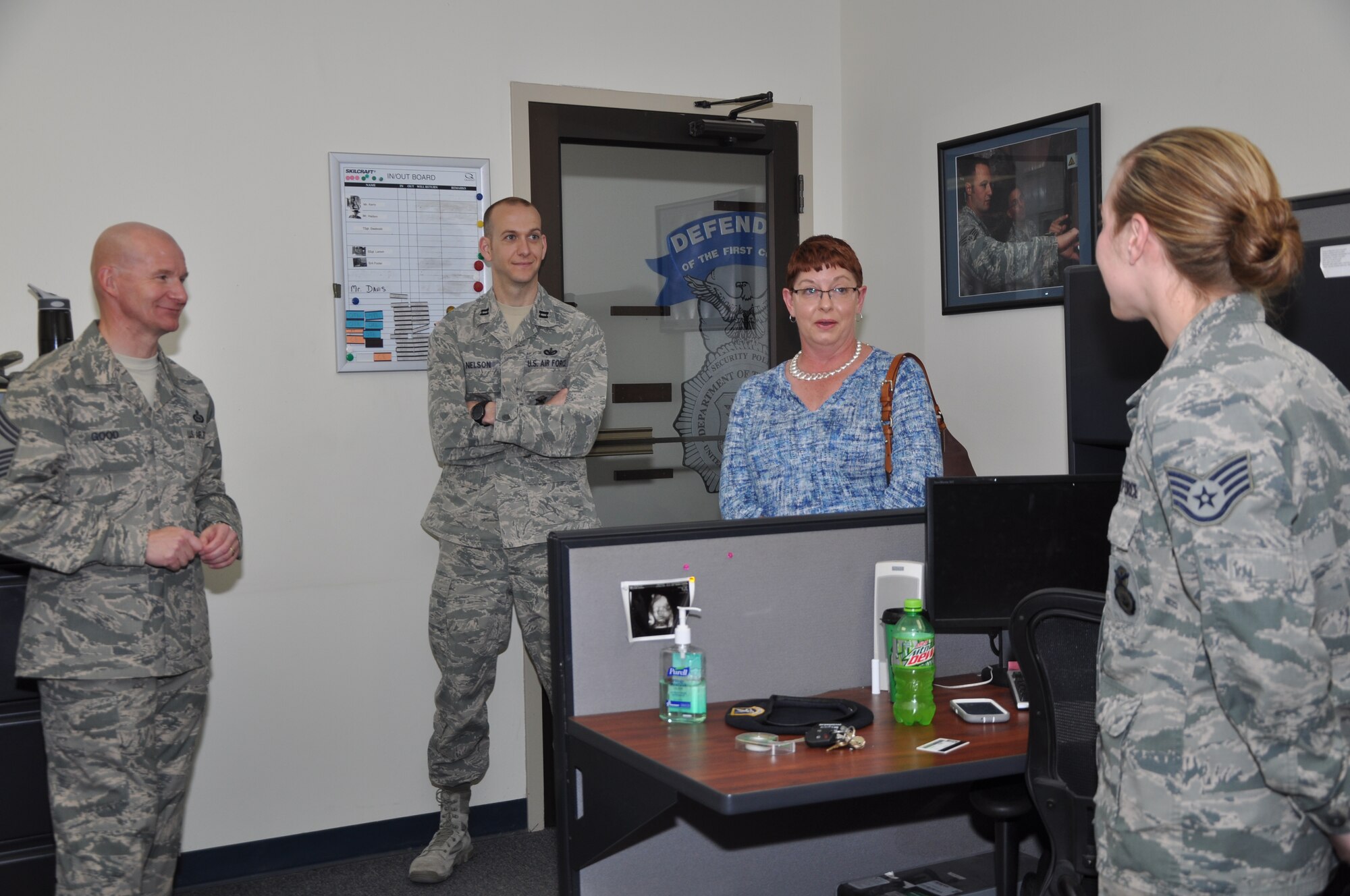 GOODFELLOW AIR FORCE BASE, Texas -- Chief Master Sgt. Thomas F. Good, 17th Training Wing command chief, Capt. James J. Nelson, 17th Security Forces Squadron Commander, and Tennie Good, family member, talk to an Airman about the Air Force at the Security Forces building during an emersion here March 18. Good took charge as the wing’s enlisted force leader and wing commander’s personal advisor in February. (U.S. Air Force photo/ Airman 1st Class Breonna Veal) 