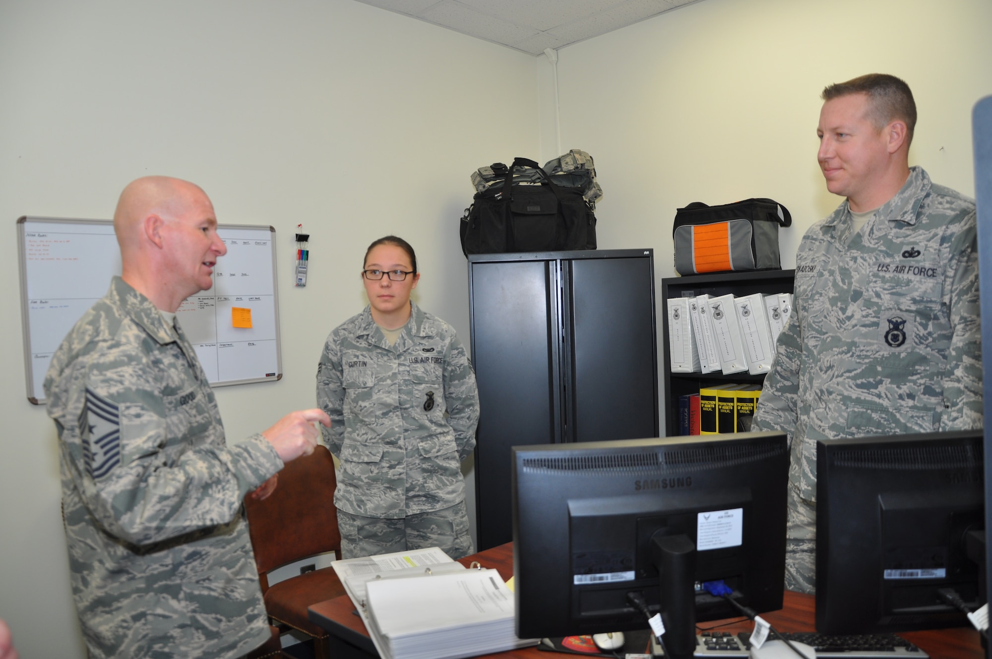 GOODFELLOW AIR FORCE BASE, Texas –Chief Master Sgt. Thomas F. Good, 17th Training Wing command chief, talks with Senior Airman Kadey L. Curtin, 17th Security Forces Squadron Plans and Programs technician and Tech. Sgt. Seth D. Swaboski, 17th SFS Plans and Programs superintendent, during an emersion here March 18. Good asked the Airmen questions about their time in the Air Force. (U.S. Air Force photo/ Airman 1st Class Breonna Veal)