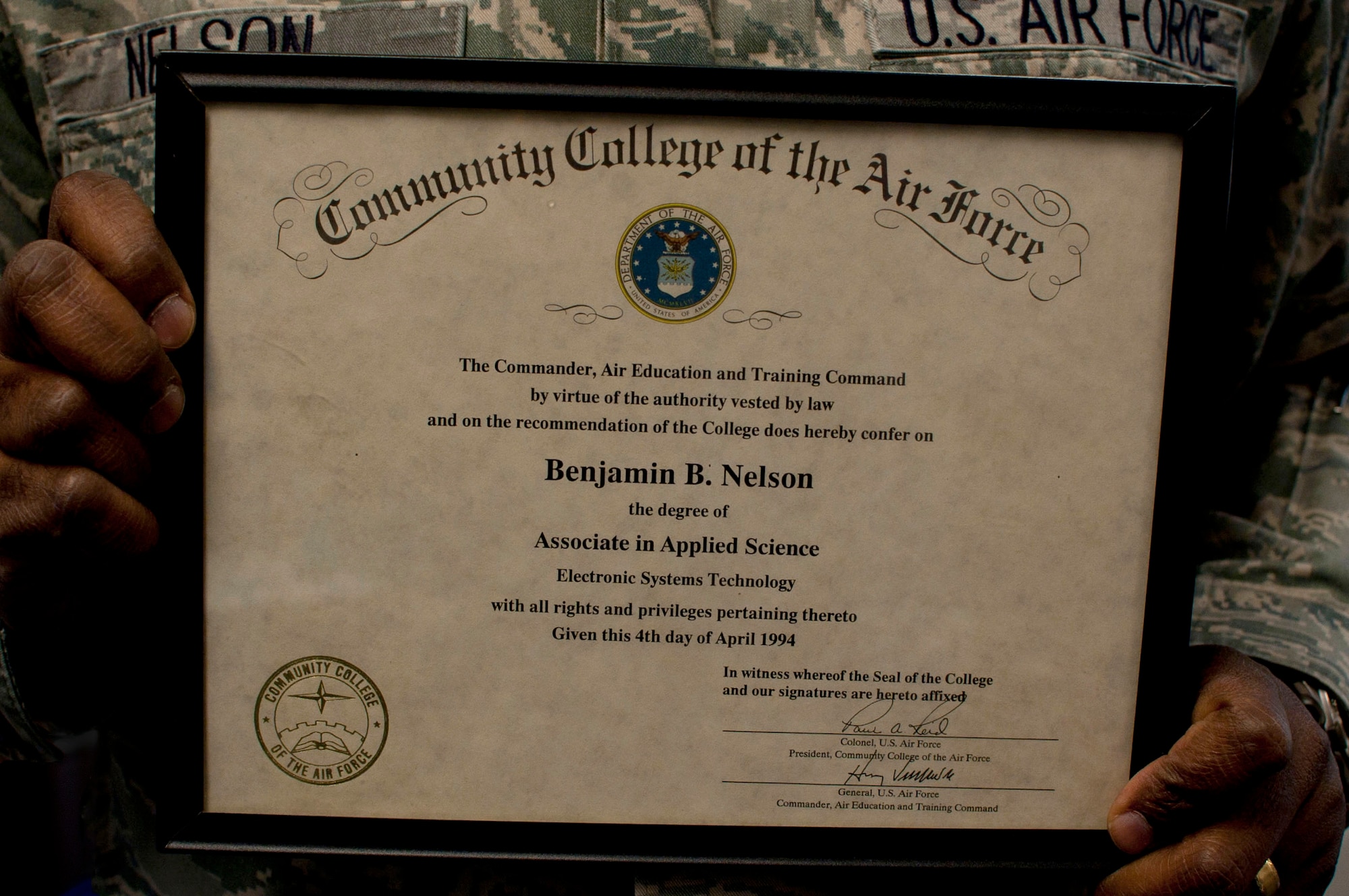 Lt. Col. Benjamin Nelson, Air University deputy communication information officer and communication technical officer, holds the Community College of the Air Force degree he received in 1994. A year later, he completed his bachelor’s degree, and commissioned through Officer Training School. (U.S. Air Force photo by Staff Sgt. Natasha Stannard)