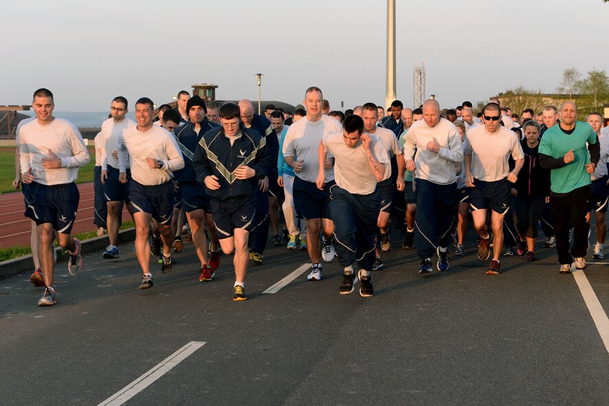 More than 100 members from Spangdahlem Air Base, Germany, begin a wing-wide 5K fun run for Sexual Assault Awareness Month at the Skelton Memorial Fitness Center April 2, 2014. The 52nd Sexual Assault Prevention and Response office and victim advocates teamed up to put on events throughout SAAM in April. (U.S. Air Force photo by Senior Airman Alexis Siekert/Released)