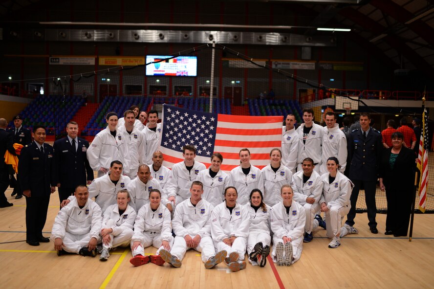 The U.S. Air Forces in Europe and Air Forces Africa men’s and women’s team poses for a photo after the final matches of a Headquarters Allied Air Command Inter-Nation Sports Programme Volleyball Championship tournament in Amsterdam, March 27, 2014. The teams consisted of 23 active-duty Air Force members stationed throughout the world. (U.S. Air force photo by Senior Airman Gustavo Castillo/Released)