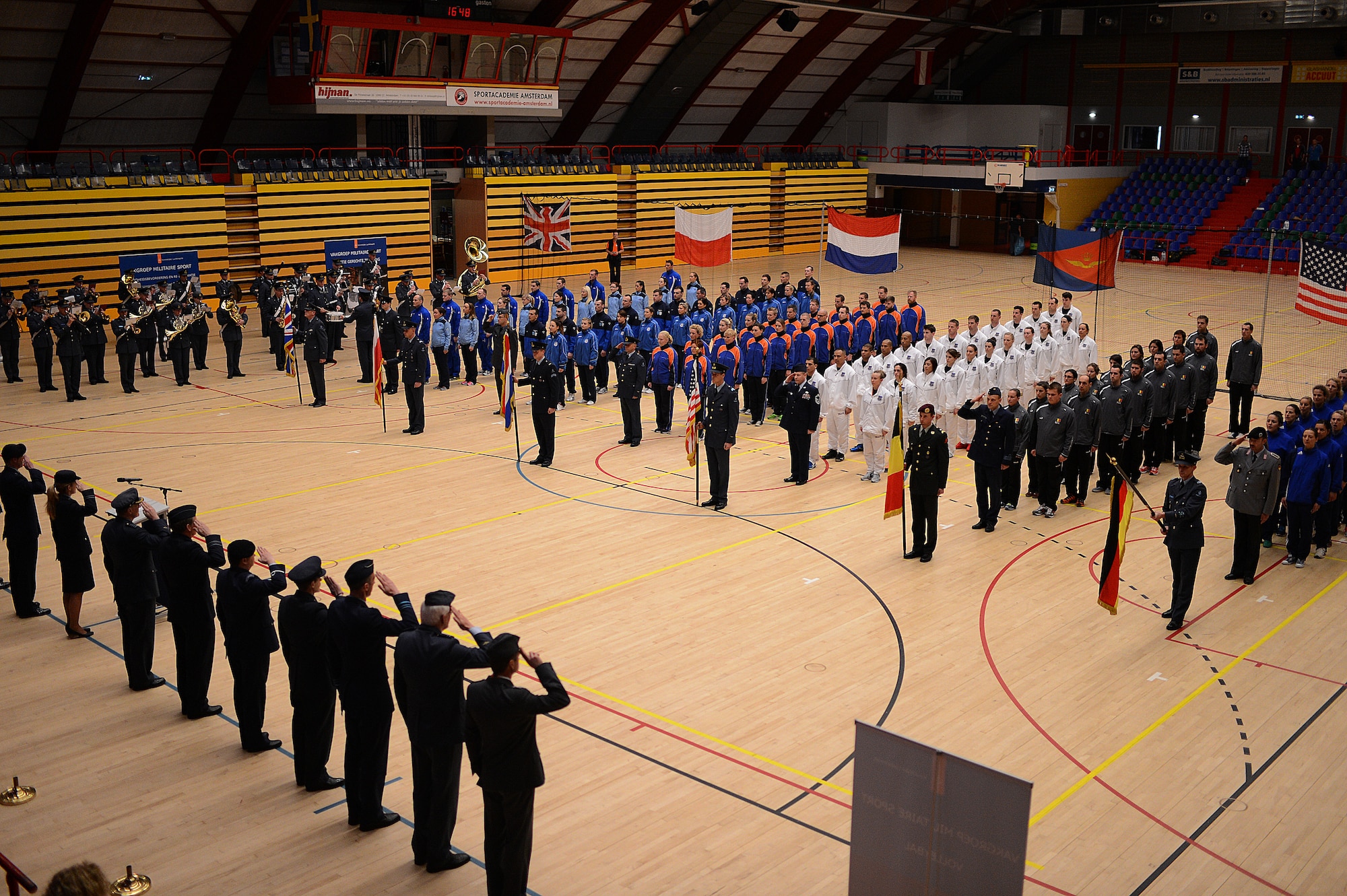 Volleyball teams from six nations form up for the closing ceremony of the Headquarters Allied Air Command Inter-Nation Sports Programme Volleyball Championship tournament in Amsterdam, March 27, 2014. Members from the U.S., Polish, British, German, Dutch and Belgian air forces represented their countries in the volleyball tournament. (U.S. Air Force photo by Senior Airman Gustavo Castillo/Released)