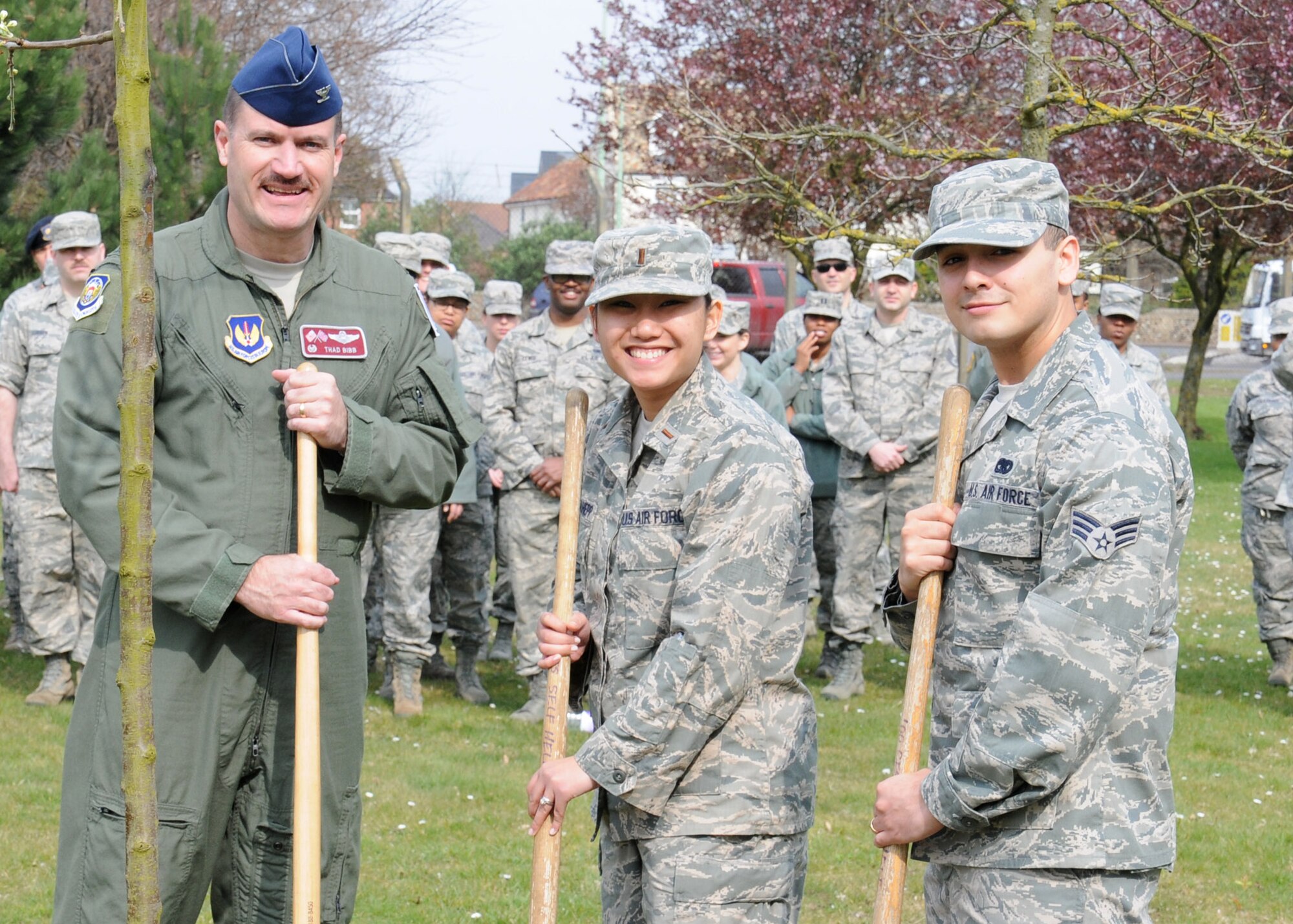 From left, U.S. Air Force Col. Kenneth T. Bibb, Jr., 100th Air Refueling Wing commander; 2nd Lt. Joanna Kohlhepp, 100th Force Support Squadron fitness and lodging operations officer from Irvine, Calif.; and Senior Airman Luis Garcia Scoville, 100th Logistics Readiness Squadron customer service journeyman from Chicago, Ill., plant a tree dedicated to RAF Mildenhall survivors of sexual assault March 28, 2014, on RAF Mildenhall, England. Bibb presented certificates to graduating victim advocates before planting the tree. The lunch that followed was an opportunity for VAs to come together and discuss the way forward. (U.S. Air Force photo by Gina Randall/Released)