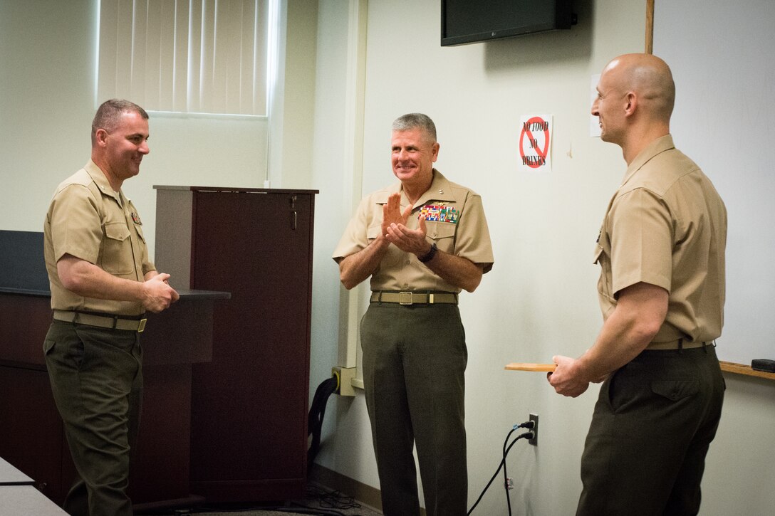 LtCol Liddi of class 4-13 presents a class gift to LtCol Simon MCCMOS Director. LtGen Murray was the guest of Honor.