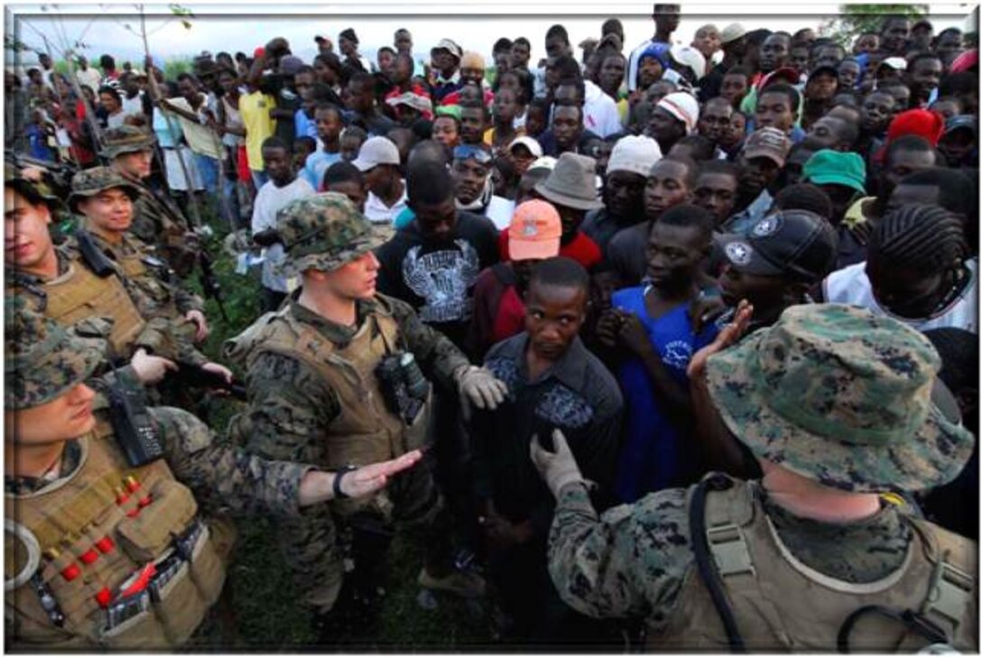 CA Marines interact with Haitian civilians in the wake of recent natural disasters.