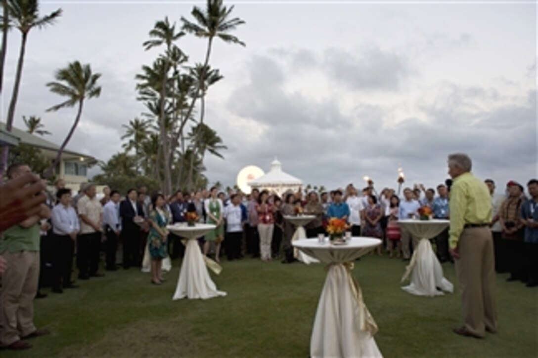 Defense Secretary Chuck Hagel, right, thanks the delegates and staff during a welcome reception at the Association of Southeast Asian Nations defense forum in Honolulu, April 1, 2014.