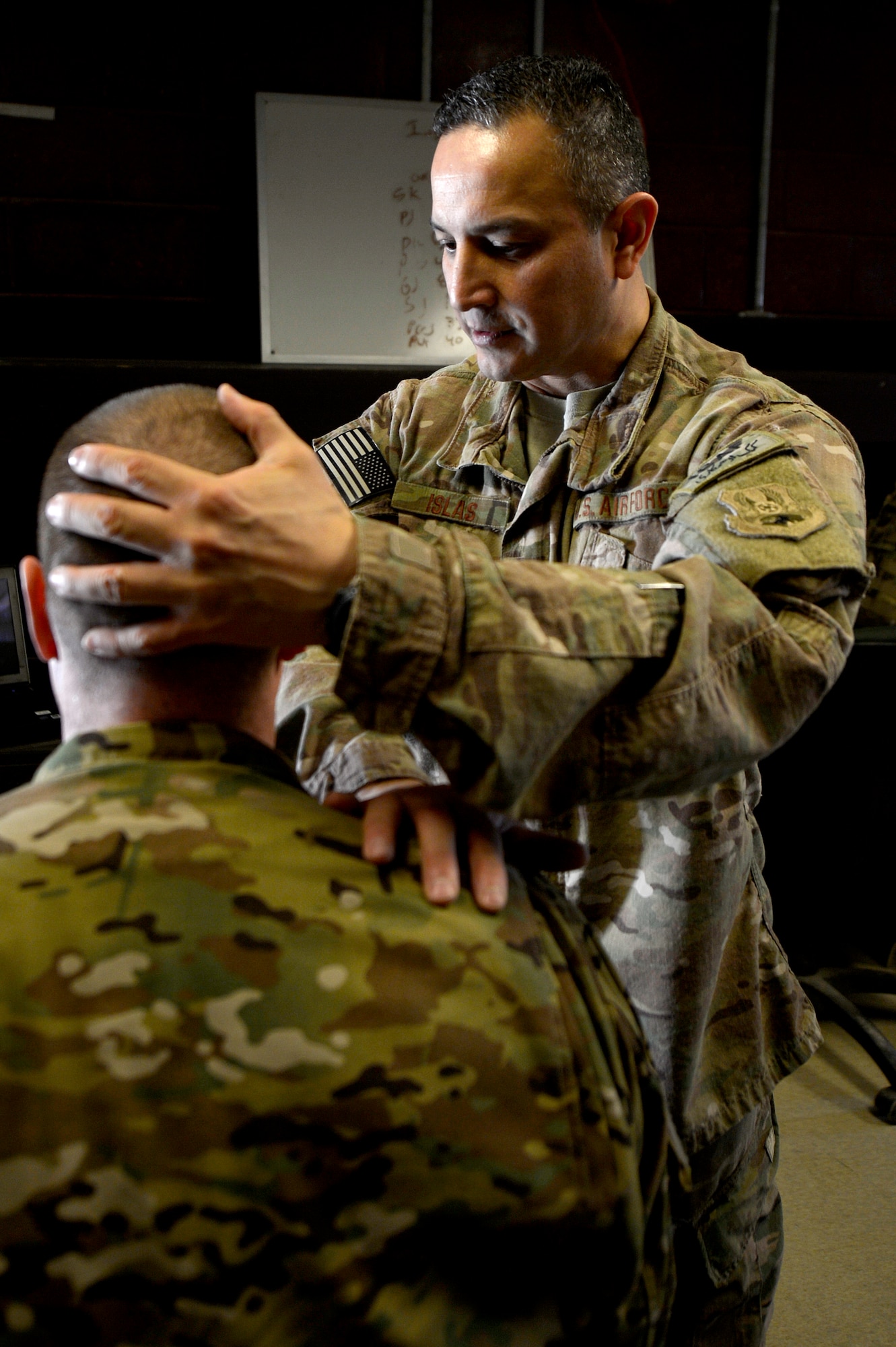 Maj. Felix Islas treats a patient Jan. 30, 2014, at Bagram Airfield, Afghanistan. Islas is the only physical therapist at Bagram and treats patients with different types of musculoskeletal problems. Islas is a native of Port Lavaca, Texas, and deployed from the 359th Medical Group at Joint-Base San Antonio-Randolph, Texas. Islas is the 455th Expeditionary Medical Operations Squadron physical therapy element chief. (U.S. Air Force photo/Senior Airman Kayla Newman)