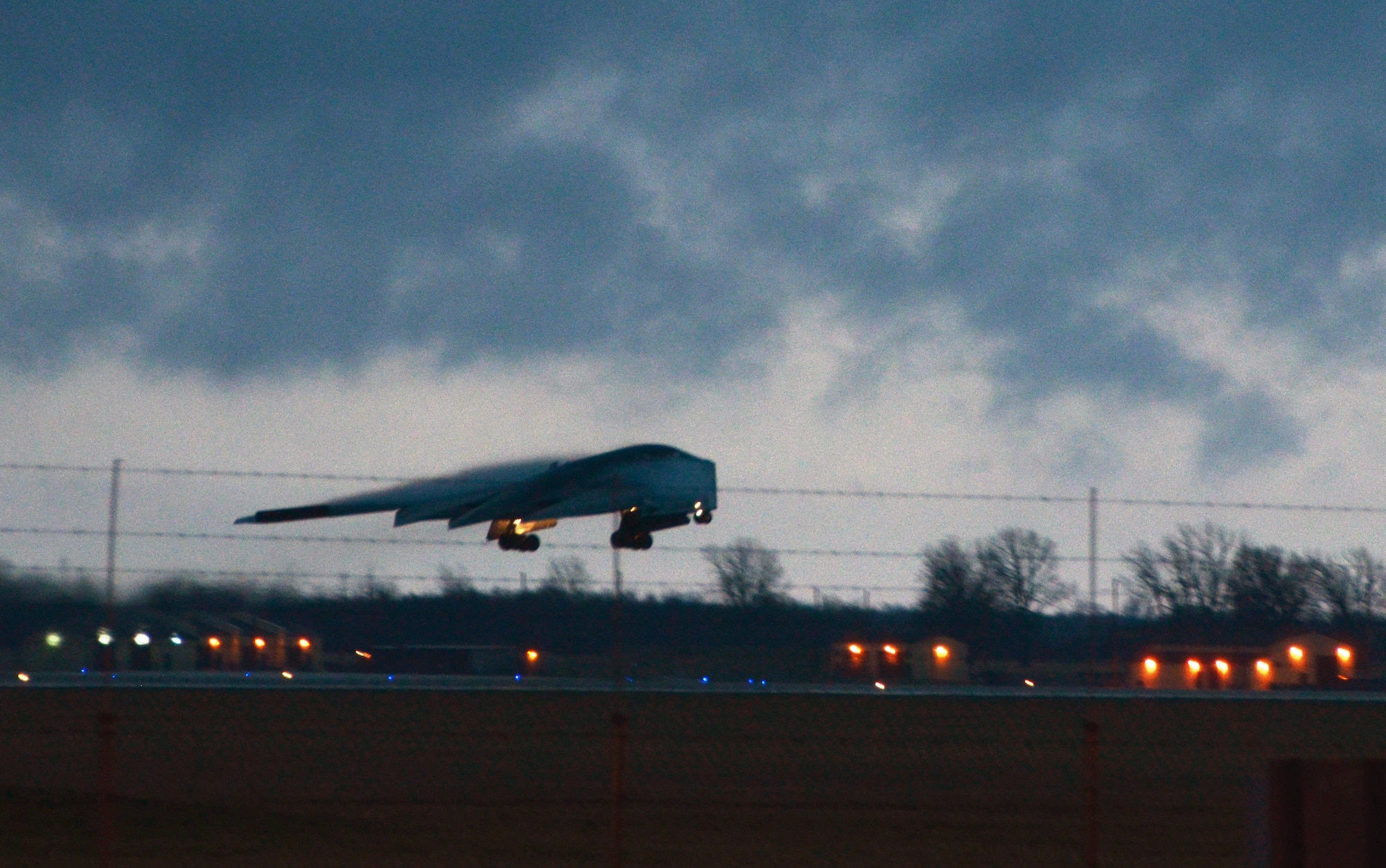 A B-2 Spirit bomber takes off at dawn from Whiteman Air Force Base, Mo, April 2, 2014.  Two B-2s and two B-52 Stratofortress bombers from Barksdale Air Force Base, La., flew nonstop from their respective home stations to training ranges within the vicinity of Hawaii and conducted long range training operations and low approach flights at Hickam Air Force Base.   (U.S. Air National Guard photo by Senior Master Sgt. Mary-Dale Amison)