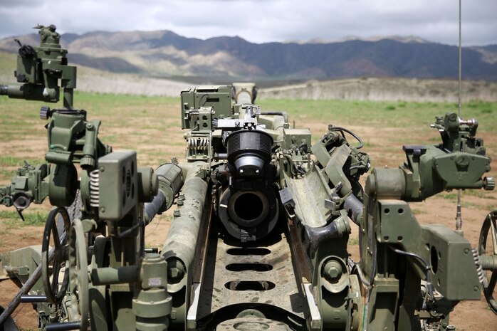 An M777A2 Howitzer sits quietly as Marines await their next fire mission. The M777A2 Howitzer is an asset to artillery units within the Marine Corps. It fires a variety of rounds exceeding 100lbs including white phosphorous, illumination and smoke rounds. The weapon system can be assembled and effectively engaging the enemy minutes after arriving on the battlefield. (U.S. Marine Corps photo by Lance Cpl. Jonathan Boynes/released)