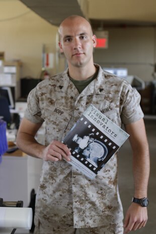 Corporal Justin A. Bopp, the reproduction graphics production chief with 1st Marine Division Combat Camera, and a native of Des Moines, Iowa, placed in several categories in the 2013 Visual Information Awards Program contest. Most notably, he placed first in publication and was the runner up for military graphic artist of the year. The VIAP contest is a prestigious competition held by the Defense Information School aboard Fort George G. Meade, Md. The service members products were evaluated by professional judges who all were experts in their fields. (U.S. Marine Corps photo by Lance Cpl. David Silvano/released)
