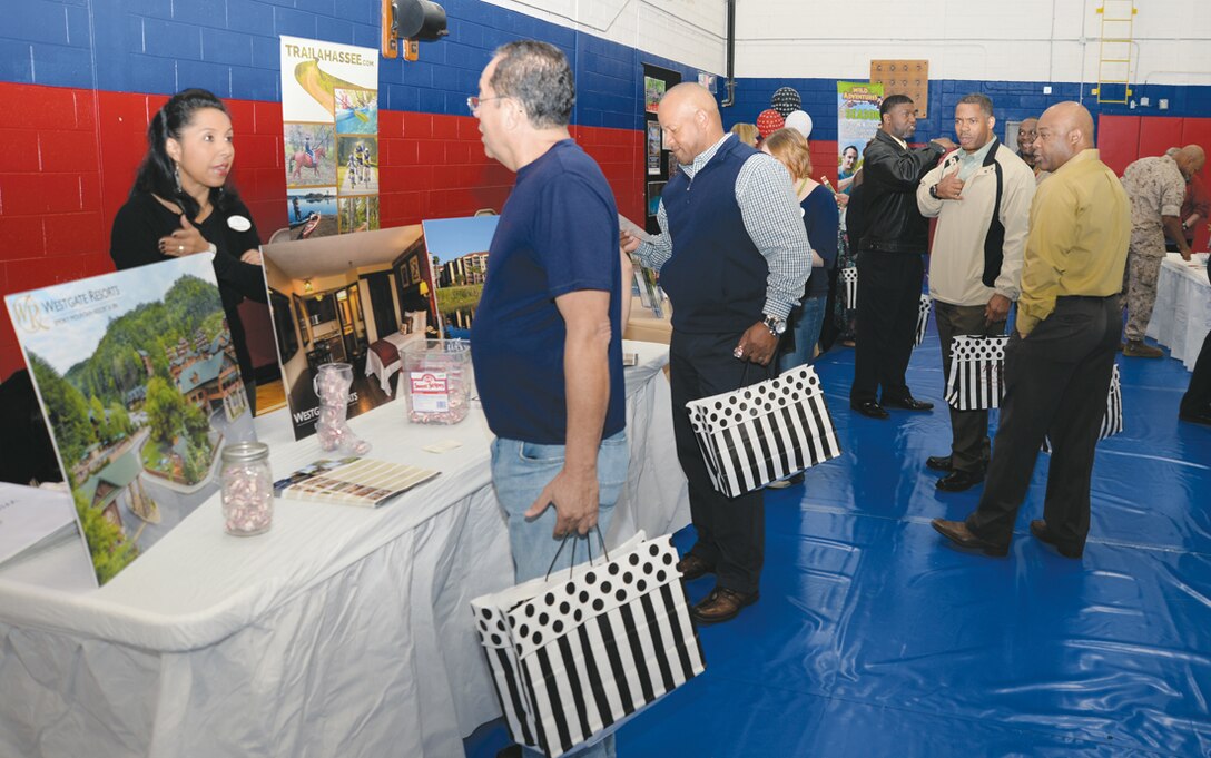 Base personnel engage in dialogue with vendors at the Marine Corps and Community Services’ Information, Tickets and Tours 16th Annual Travel and Recreation Trade Show held at Marine Corps Logistics Base Albany, March 19.