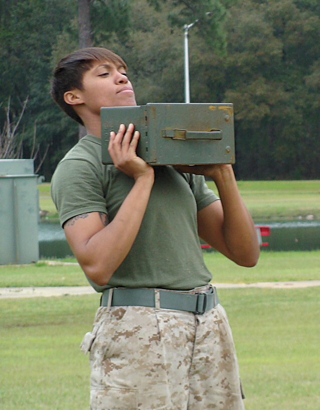 Cpl. Candice Clark, supply administration clerk, Marine Corps Systems Command, trains using an ammunition can during the High Intensity Tactical Training level 1 training course March 18-21 at Covella Pond, here.