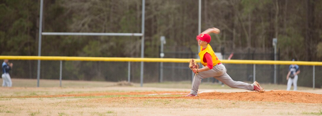 Chris Rodriguez, starting pitcher for the Lejeune Devilpups, throws the ball during their baseball game against the East Carteret High School Mariners aboard Marine Corps Base Camp Lejeune, March 28. The Lejeune Devilpups struggled to hit the ball throughout the game, ultimately resulting in a 7-1 loss against the Mariners. When asked about the loss, Martin Ortega, third baseman for the Lejeune Devilpups responded, “It’s important for us to stay strong. Of course we were down, but we didn’t have a choice, we kept pushing no matter what. In my eyes it’s important to show strength even when you’re down.”