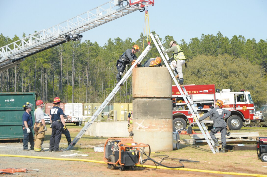 Marine Corps Logistics Base Albany firefighters practice rescuing a victim during the Twisting Thunder 2014 exercise April 1, 2014, at Marine Corps Logistics Base Albany. 